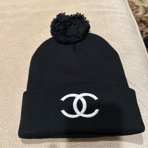 Black with white embroidered women’s Pom Pom hat